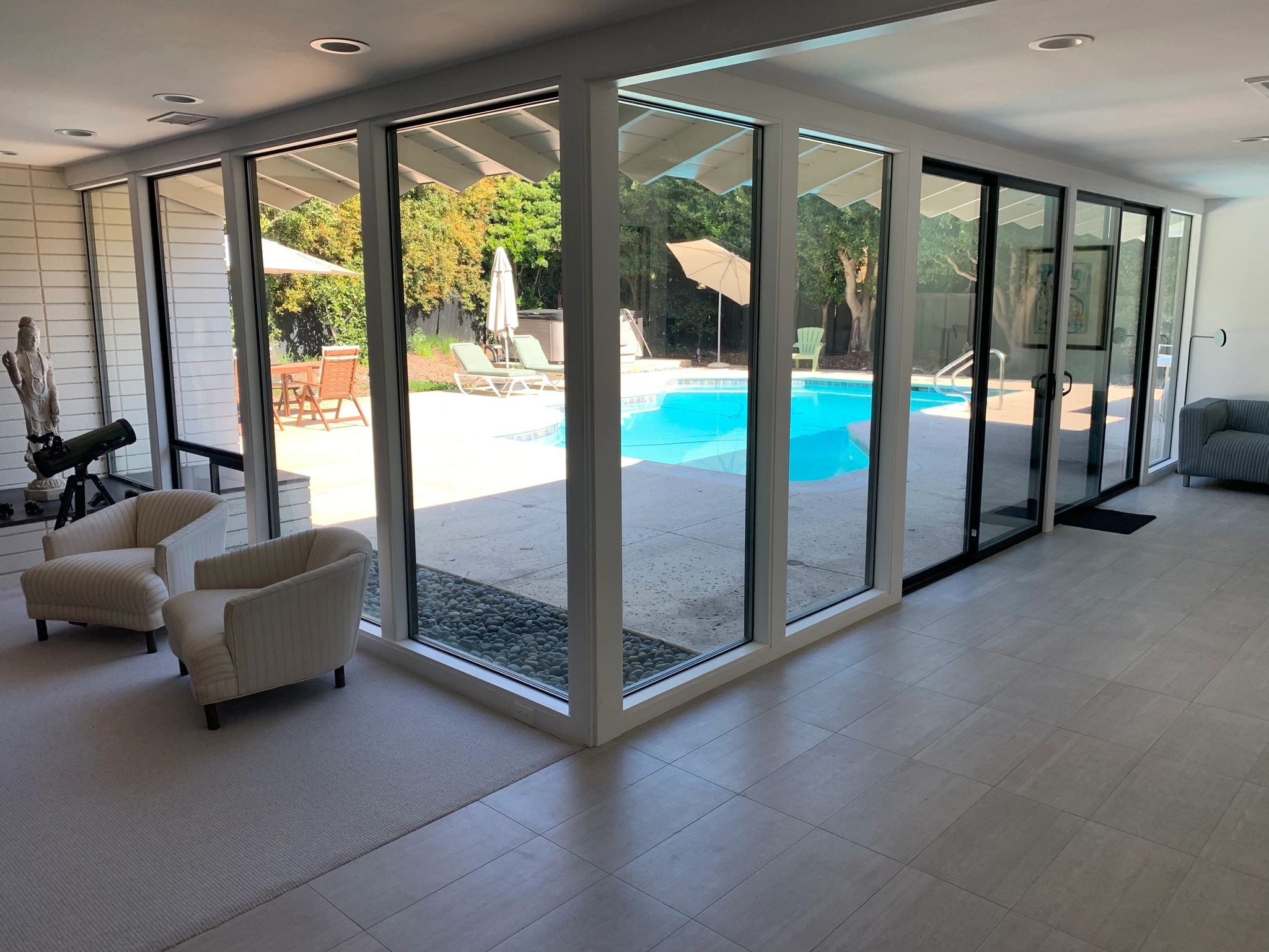 Interior glass sliding doors with pool view
